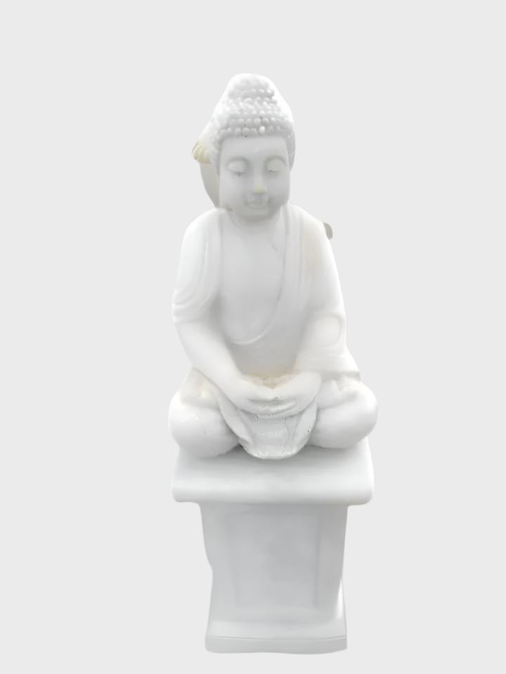 Buddha on stand made of concrete
