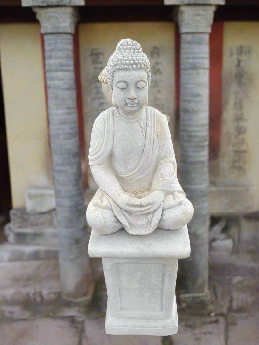 Buddha on stand made of concrete