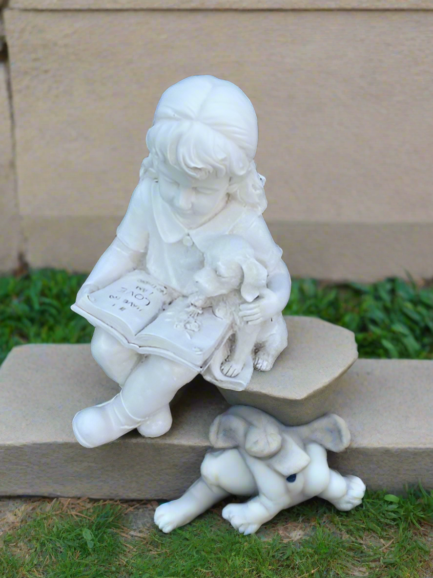Girl statue reading